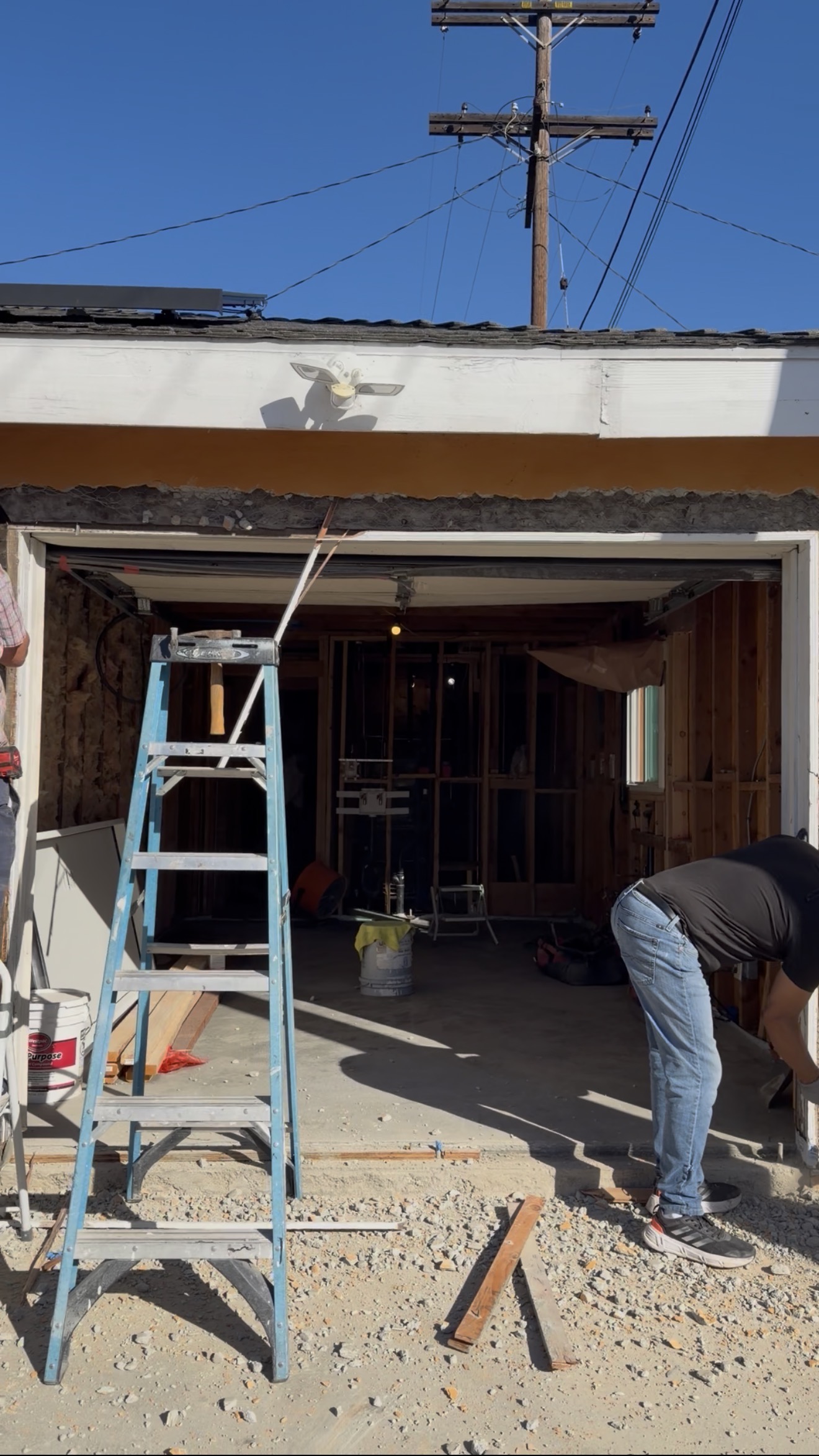 Crew working on garage conversion framing