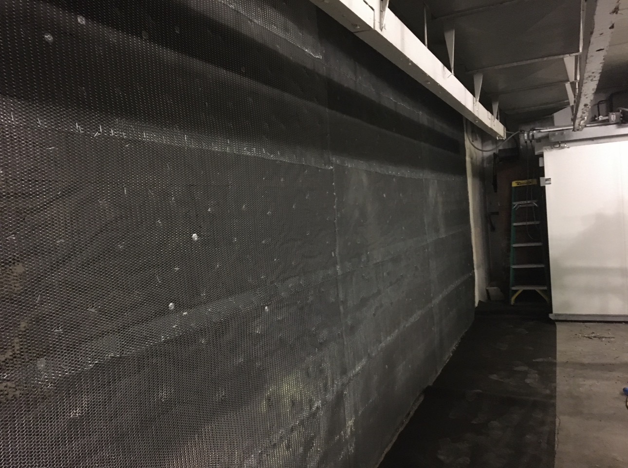 Metal lath backing installed during refrigeration wall restoration