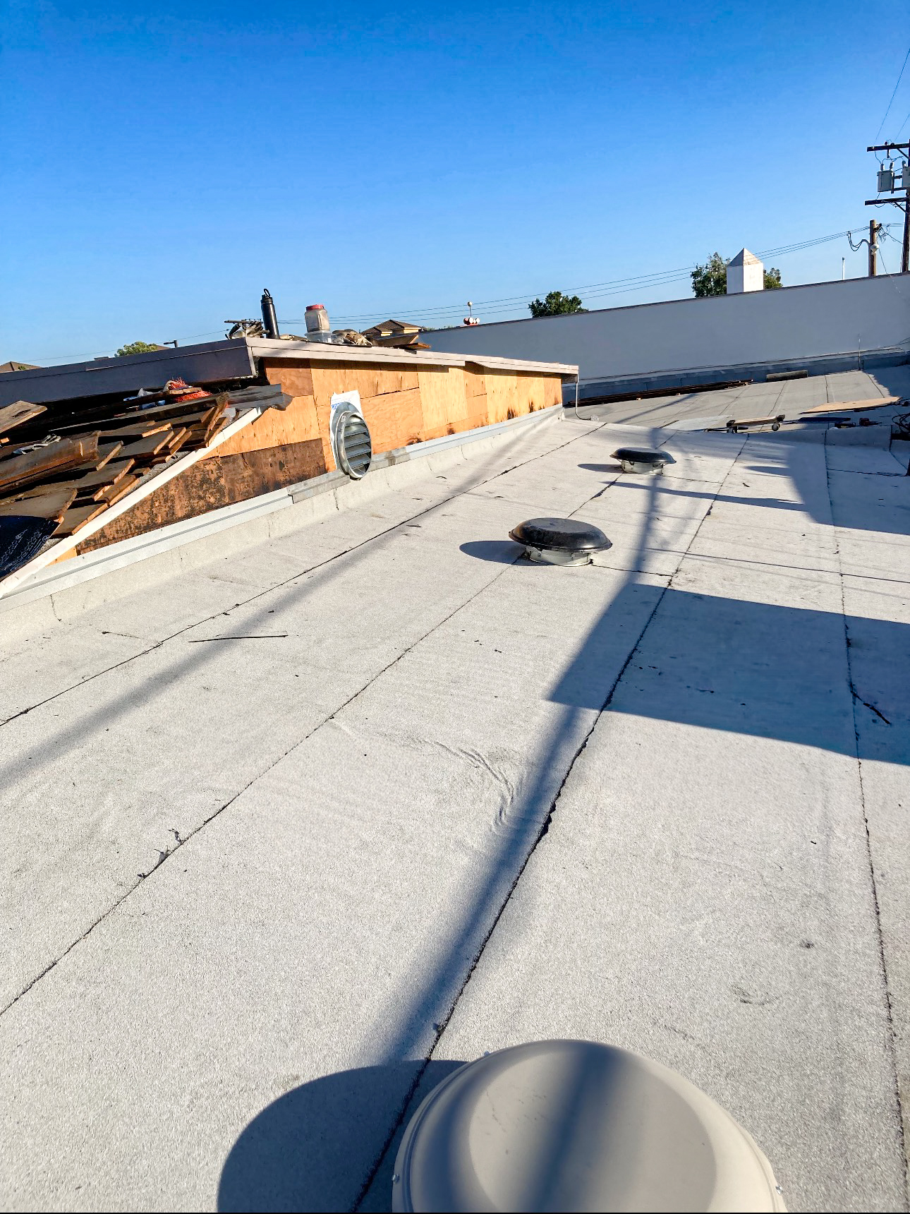 Completed flat roof with new membrane roofing system in Downey