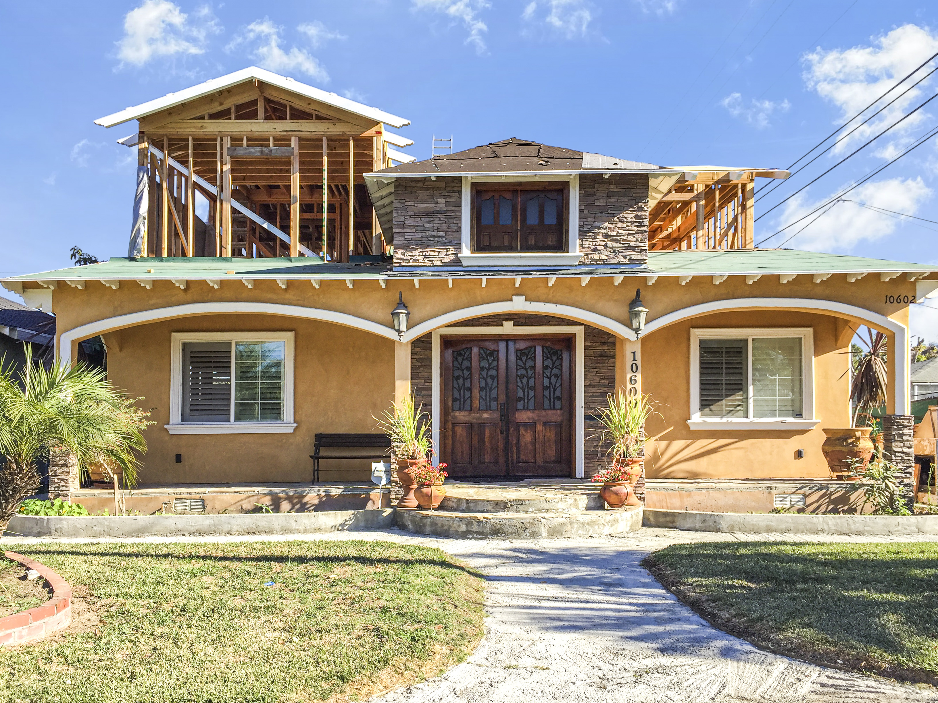 Front elevation with second-story framing going up above original single-story structure