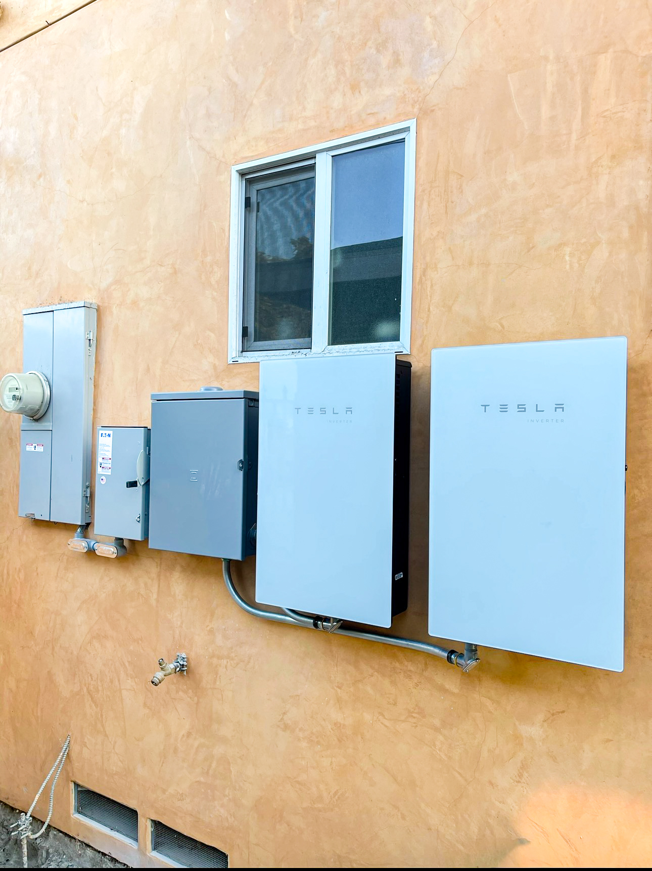 Tesla solar panel and Powerwall installation on residential roof in South Gate