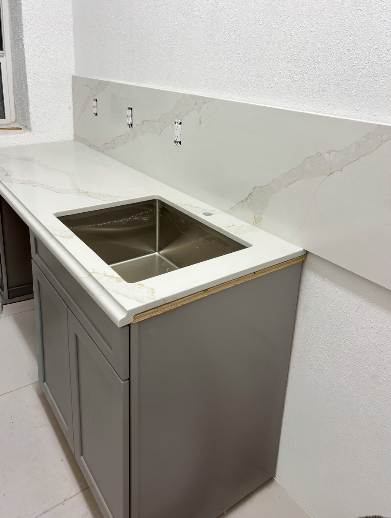 Sink and plumbing installation in commercial breakroom kitchen