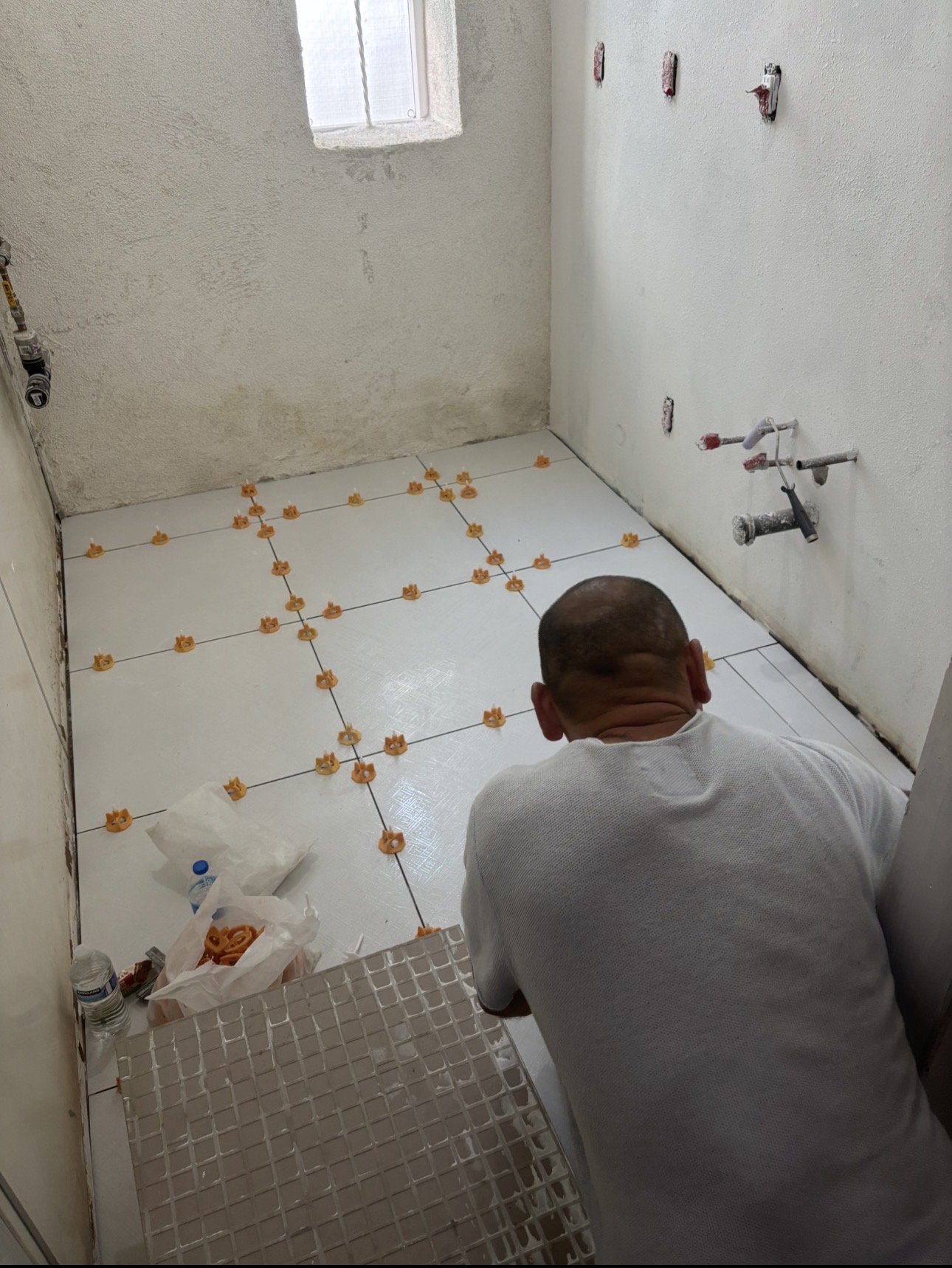 Tile flooring installation in warehouse breakroom